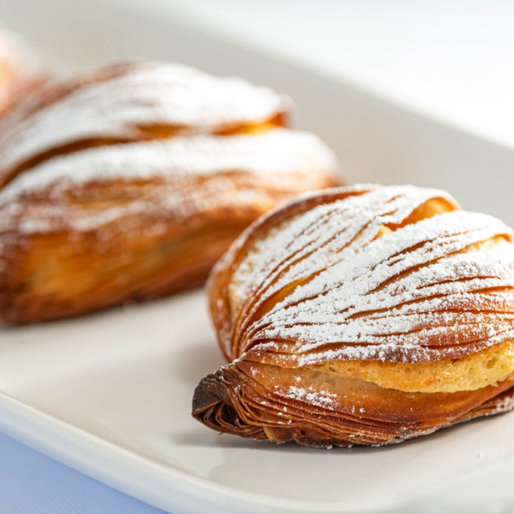 sfogliatelle with powdered sugar