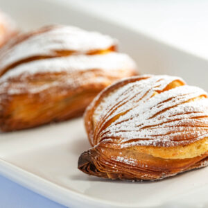 sfogliatelle with powdered sugar